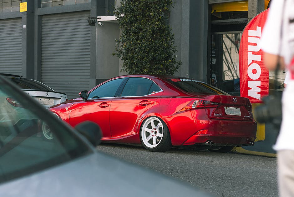A sleek red Lexus car parked outdoors in São Paulo, showcasing luxury automotive design.